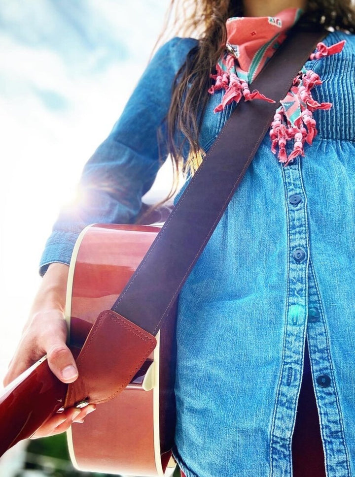 Full grain leather guitar strap, look good while sounding good!  Easily adjustable for the perfect fit.  Antique brass hardware.  Get it personalized and make the perfect gift.  Handmade in Austin, TX!