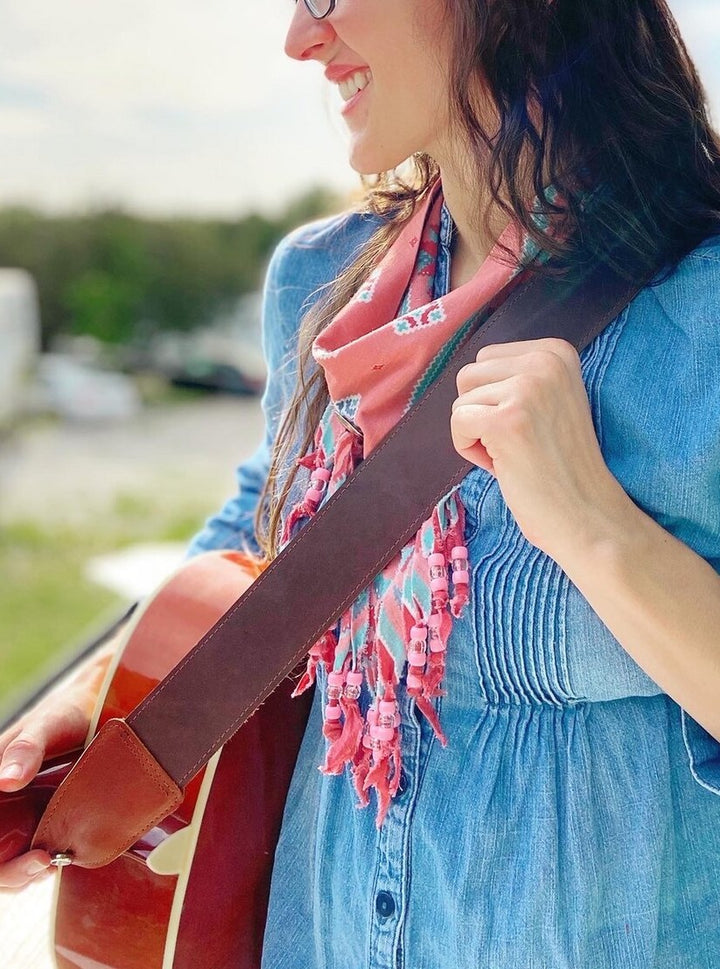 Full grain leather guitar strap, look good while sounding good!  Easily adjustable for the perfect fit.  Antique brass hardware.  Get it personalized and make the perfect gift.  Handmade in Austin, TX!