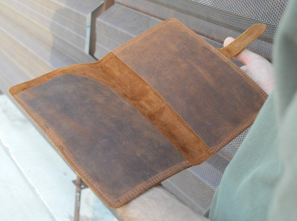 The Colorado leather journal Fits A5 Moleskine notebook Paper.  It features a strap closure and paper organizer.  Made from premium full grain leather.  Get it personalized and make the perfect gift.  Handmade in Austin, Texas!