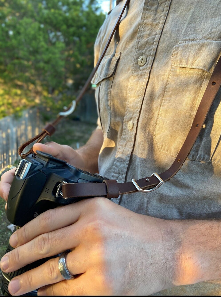 The Bates leather camera strap is the perfect addition for your camera gear.  Features conway hooks, making it easy to adjust to a comfortable length.   Made from full grain leather.   Hand made in Austin, TX!