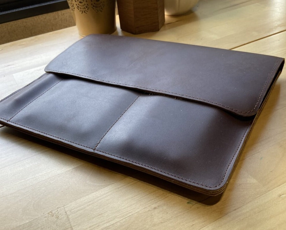 This sleek full grain leather sleeve is made to fit tablets that are 12” x 8.75” x .5”   Extra pockets will carry your field notes and a phone up to 3” wide.  Water resistant and Provides protection from minor falls.  Personalize it and complete the perfect gift!  Made in Austin, Texas