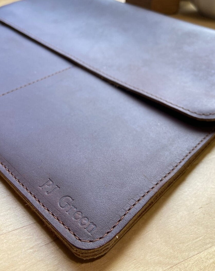 This sleek full grain leather sleeve is made to fit tablets that are 12” x 8.75” x .5”   Extra pockets will carry your field notes and a phone up to 3” wide.  Water resistant and Provides protection from minor falls.  Personalize it and complete the perfect gift!  Made in Austin, Texas